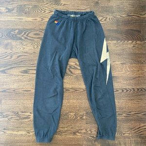 Black aviator nation swears with gold bolt